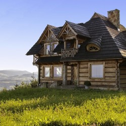 Wooden house near montains